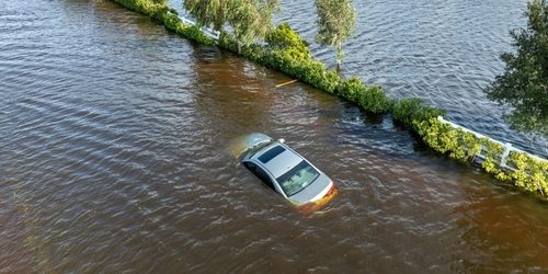 Flooded,Florida,Street,With,Stuck,Car,After,Hurricane,Debby,Rainfall