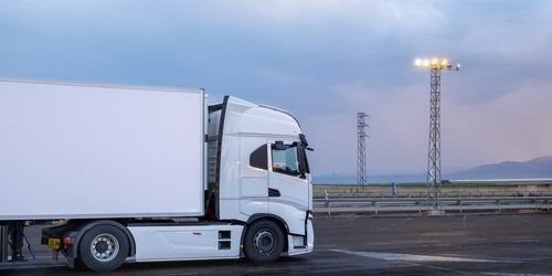 A,Big,White,Truck,Parked,At,A,Service,Station,At