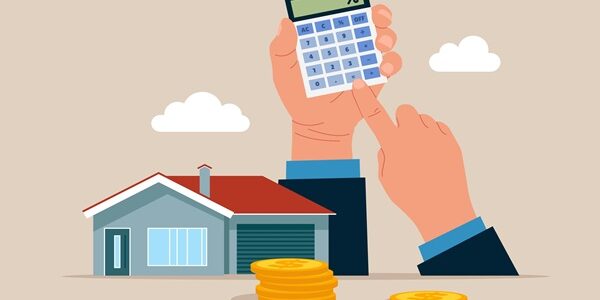 Hands,Holding,A,Calculator,And,Home.,Calculating,Property,Investment,Costs.