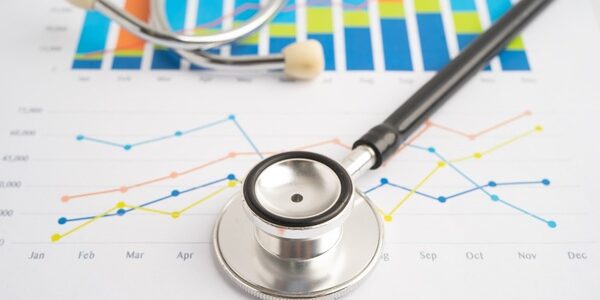 Stethoscope,On,Chart,Or,Graph,Paper,,Financial,,Account,,Statistics,And